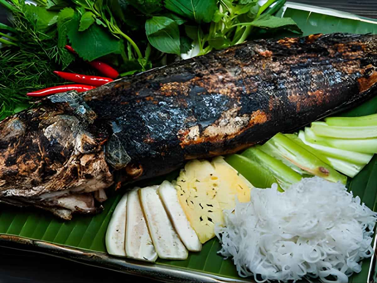 Cá lóc nướng trui gắn liền sinh hoạt dân dã vùng sông nước An Giang.