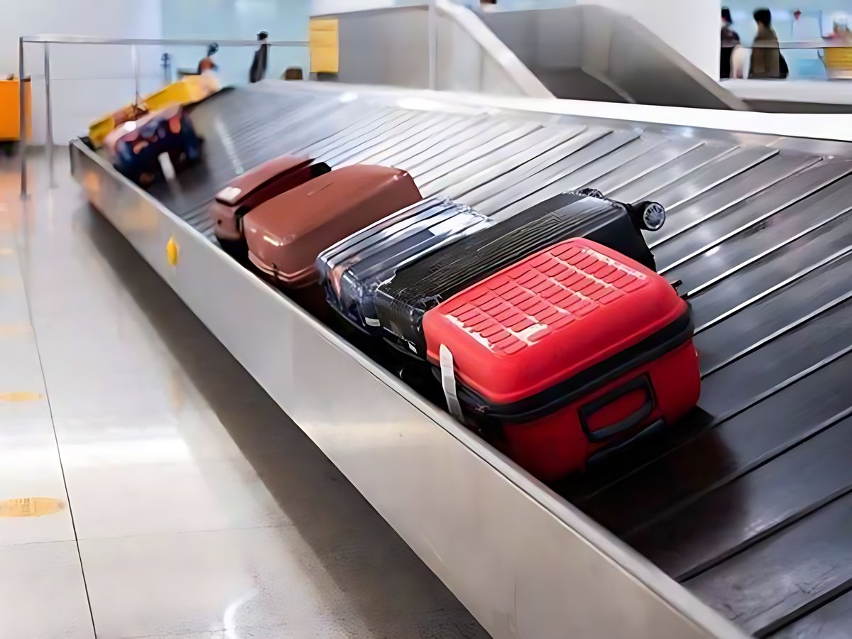 Travelers completing immigration procedures and collecting baggage at the airport.