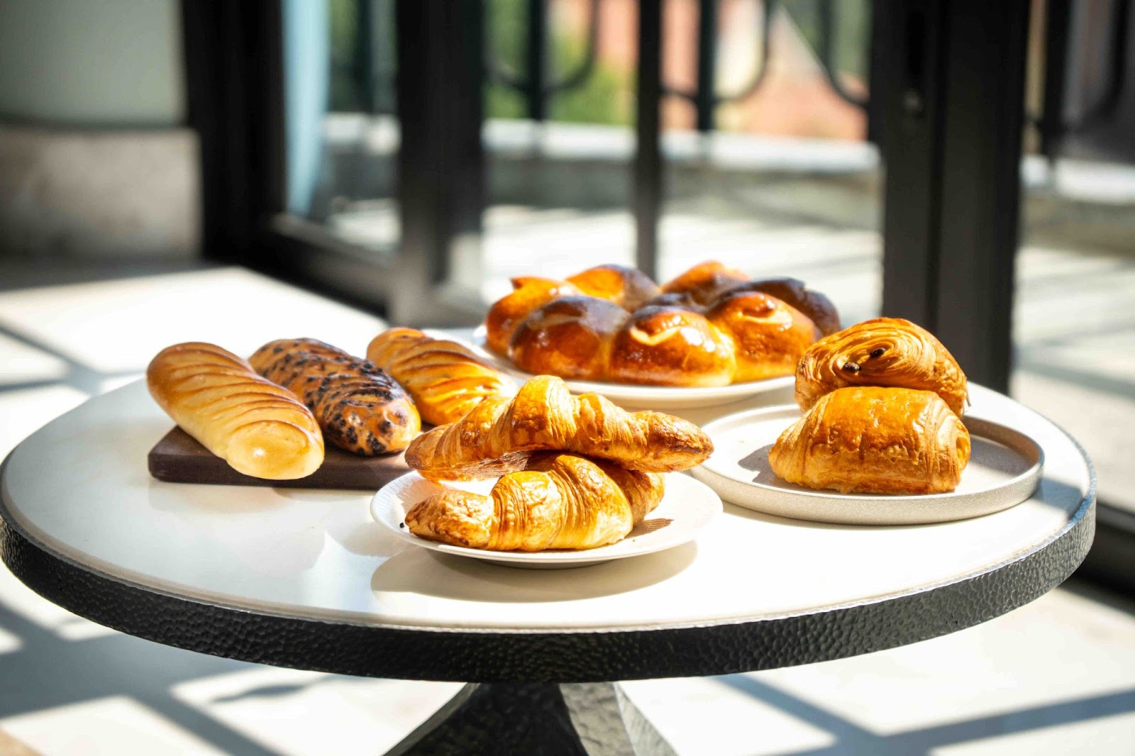 An appetizing array of French pastries from Eric Krayser, including croissants and baguettes, available at venues within the Sunset Bazaar 